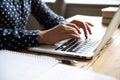 Close up view image female hands typing on laptop keyboard