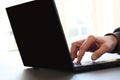 Close-up image of a finger touching texting on keyboard on a laptop computer. Stock photo with white background for copy