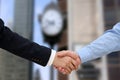 Close-up image of a firm handshake between two colleagues in of