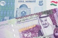 Tajik money close up with Saudi Arabian money