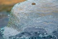 Flowing water from a fountain creating a tranquil and peaceful atmosphere Royalty Free Stock Photo