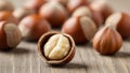 Freshly cracked hazelnut on wooden surface Royalty Free Stock Photo