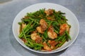 Close-up image of fried asparagus, put fresh shrimp, Thai food, put on a stainless steel background plate Royalty Free Stock Photo