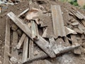 A close-up image of a garbage dump with destroyed brick and wooden planks. The concept of disaster, debris Royalty Free Stock Photo