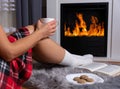 Cozy Winter Evening: Warmth and Relaxation by the Fireplace Royalty Free Stock Photo