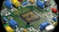 Detailed view of electronic circuit board with microchip and various components Royalty Free Stock Photo