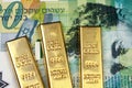 A twenty Israeli shekel bank note with three small gold bars