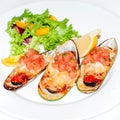 Close-up image grilled clam mussel and cheese with salad and lemon