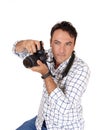 A young man holding his camera ready for a shoot Royalty Free Stock Photo