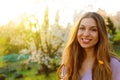 Close up image of happy brunette woman in spring or autumn clothes posing outdoors Royalty Free Stock Photo
