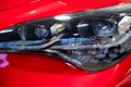 Close-up image of headlights of red sportcar Royalty Free Stock Photo