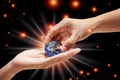 A close up image of a human hand holding a light-emitting planet Ecology concepts And changing the world,Elements of this image