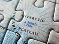 Close up of a jigsaw puzzle map depicting Antarctic