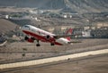 Leh, Jammu and Kashmir, India - June 26, 2011 : Kingfisher Airlines airbus A-320 # VT-DKR takes off from Leh Royalty Free Stock Photo