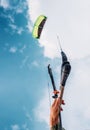 Close up image kitesurfer hand with kite in blue sky Royalty Free Stock Photo