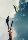 Close up image kitesurfer hand with kite in blue sky Royalty Free Stock Photo