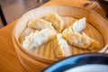 Close up image of Korean style steamed dumplings on a bamboo steamer Royalty Free Stock Photo