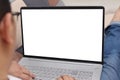 Close up image of laptop mock up, computer monitor with white screen template, man typing on laptop