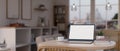 Close-up image of a laptop mockup on a table in a modern cozy room Royalty Free Stock Photo