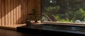 Luxury beautiful Japanese Onsen or jacuzzi against the large glass window with beautiful nature view