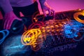 Close-up image of male hands, dj making sounds at night club party with professional sound mixer Royalty Free Stock Photo