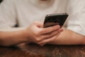 Close-up image of male hands using smartphone searching or social networks concept,