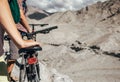 Close up image man hand on bicycle saddle. Two maountain bikers Royalty Free Stock Photo