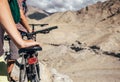 Close up image man hand on bicycle saddle. Two maountain bikers Royalty Free Stock Photo