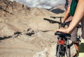 Close up image man hand on bicycle saddle. Two maountain bikers Royalty Free Stock Photo