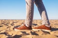 Close up image of man legs walking alone sandy beach with blue ocean and white sand, Royalty Free Stock Photo