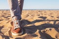 Close up image of man legs walking alone sandy beach with blue ocean and white sand, Royalty Free Stock Photo