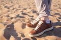 Close up image of man walking alone sandy beach with blue ocean and white sand Royalty Free Stock Photo