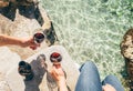 Close up image man and woman hands with goblet of wine at the se Royalty Free Stock Photo