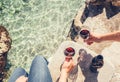 Close up image man and woman hands with goblet of wine at the se Royalty Free Stock Photo