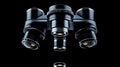 Close up image of a microscope on a black background highlighting lens details and reflections Royalty Free Stock Photo