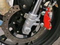Close up image of motorcycle front brake disc system. Royalty Free Stock Photo