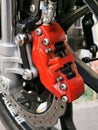 Close up image of motorcycle front brake disc system. Royalty Free Stock Photo