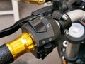 Close up image of motorcycle headlight, turn signal and horn buttons. Royalty Free Stock Photo