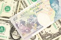 A UK five pound note on a background of one dollar bills Royalty Free Stock Photo