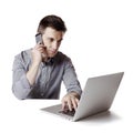 Close up image of multitasking business man using a laptop and mobile phone Royalty Free Stock Photo