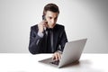Close up image of multitasking business man using a laptop and mobile phone Royalty Free Stock Photo