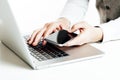 Close up image of multitasking business man using a laptop and mobile phone Royalty Free Stock Photo