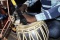 Close up image of musician hand playing tabla, an Indian classical music instrument with a focus on the front hand Royalty Free Stock Photo