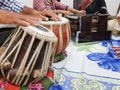 Close up image of musician hand playing tabla, an indian classical music instrument with focus on front hand Royalty Free Stock Photo