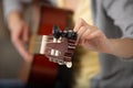 close-up image musician tunning guitar