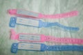Close-up image with new born babies tags, blue for boys and pink for girls in a maternity