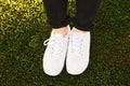 Close up image of new white sneakers wearing by a girl Royalty Free Stock Photo