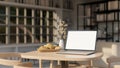 Close-up image, Notebook laptop mockup on wood table in modern contemporary living room