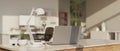 Close-up image of an office desk with a laptop in a modern white office room Royalty Free Stock Photo