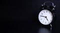 Close up image of old black vintage alarm clock. Four o`clock and forty-five minutes Royalty Free Stock Photo